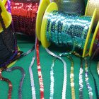 paillettes a metraggio piatte