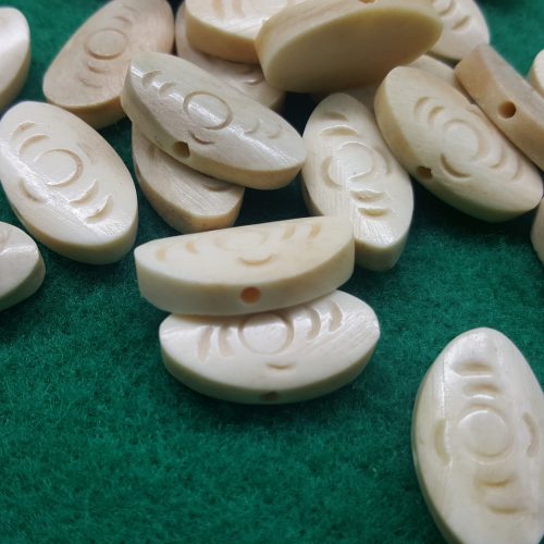 perla in osso di forma ovale