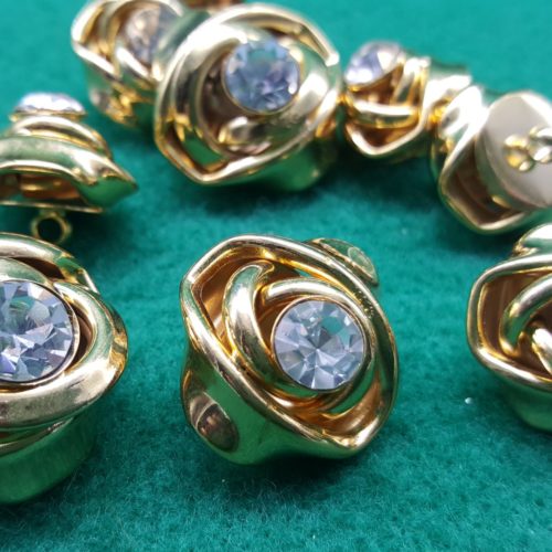 bottoni dorati intreccio con strass