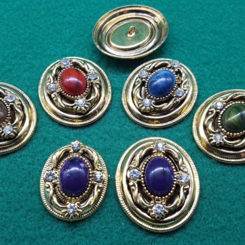 bottoni dorati ovali con pietra e strass