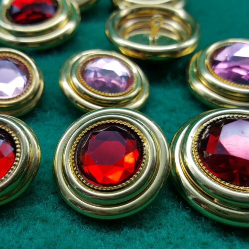 BOTTONI DORATI DUE ANELLI E PIETRA ACRILICA