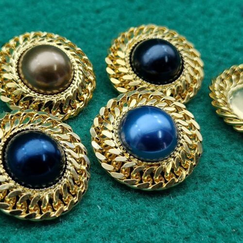 bottoni dorati con perla colorata